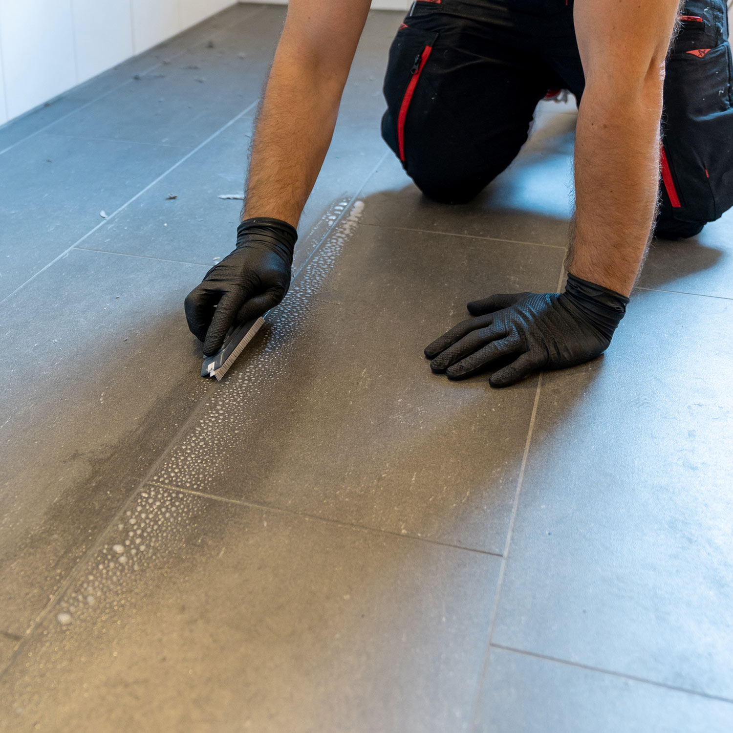 Man Cleaning Tile and Grout